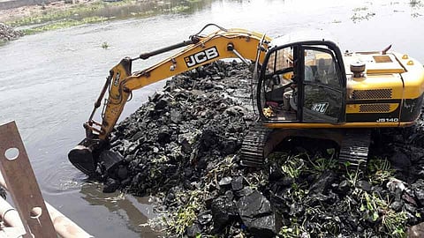 Debris being removed from Mutha river by PMC