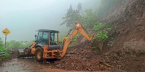 Debris being removed after landslide at Sinhagad Fort Ghat road.