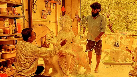Artisans working on Goddess Durga idols for Navratri
