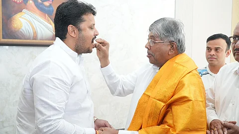 Balwadkar and Patil met publicly, exchanging sweets in a gesture of unity