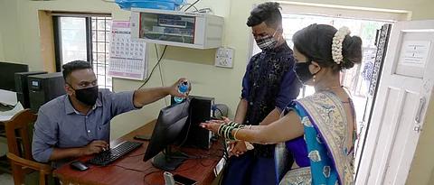Masked bride and groom, sanitized certificate: Welcome to the new normal of marriage registration