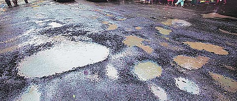 Potholes on city roads slow down traffic