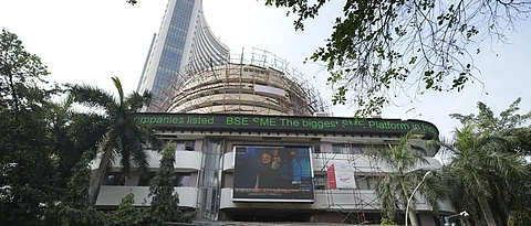 Sensex hits record high, Nifty trades over 11,000 mark