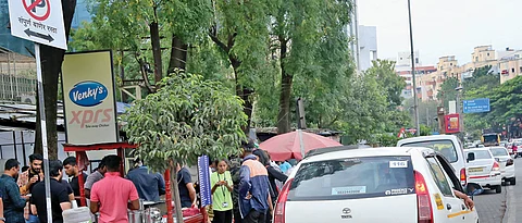 Residents, shopkeepers protest against no-parking rule