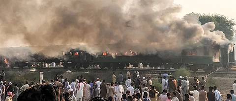 73 killed as train catches fire as passengers cook breakfast in Pakistan