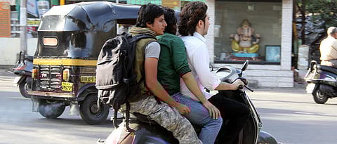 Face action for carrying two or more kids on 2-wheeler