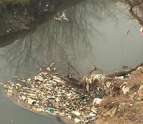 Doodh Ganga with solid waste at village Wathoora