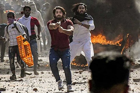 Delhi HC denies bail to man seen pointing a gun at a police officer during Delhi riots