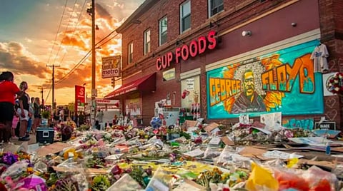 Flowers and tributes placed in front of the Cup Foods in Minneapolis near where George Floyd was killed. Photo: Vasanth Rajkumar/Wikimedia Commons