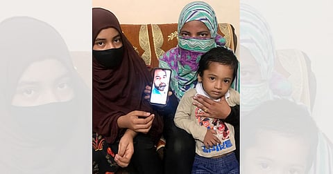 Family members of the ‘Al Qaeda’ terror-accused Mushiruddin, 44, hold a photo of him over a month since his arrest by the UP ATS/Sabah Gurmat