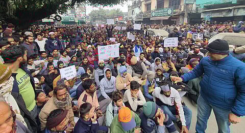 Despite the cold, women, Youth and children sitting on dharna out in the open
