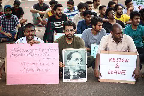 We need change,' a poster held by a student while a couple of others sat with pictures of Dr. BR Ambedkar