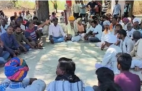 Community members waiting outside the hospital on Sunday.