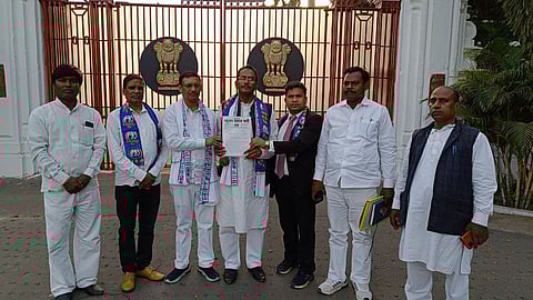 BSP state president with the memorandum outside the raj bhawan
