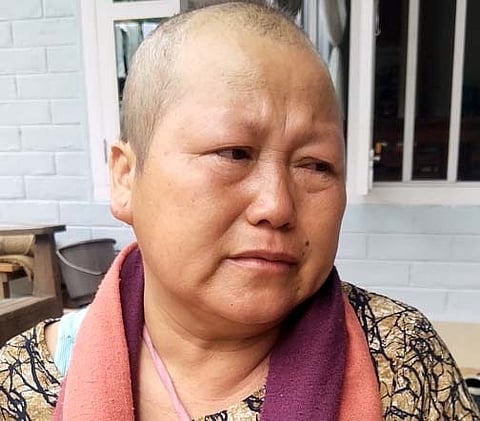 Chinkhoneng Baite's husband Jamkhothang Baite was once a famous football player. All the money earned in the game was spent on cancer treatment. Now there is no money for further treatment. Location- A house just opposite Rengkai Relief Camp, Churachandpur.