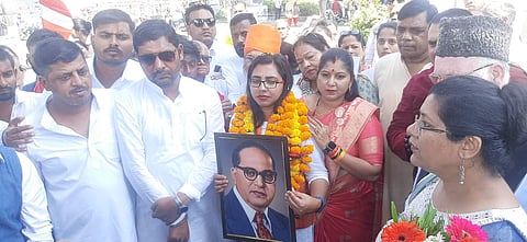 Nisha Bangre and her supporters staged a sit-in on the road, leading to a confrontation with the Bhopal police on Monday.