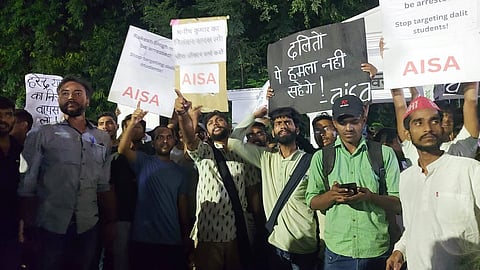 The students protested against the university administration and demanded the arrest of the Chief Proctor under the SC/ST act.