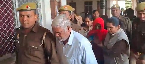 The couple being taken away by the police after court verdict.