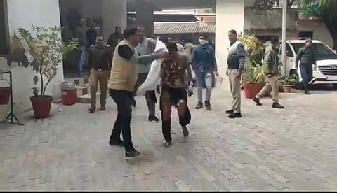 Quick action by police officials at the office helped extinguish the flames, and the severely burnt youth was rushed to the district hospital.