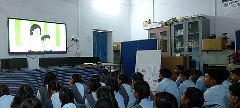 Students watching short film on inappropriate touching in a govt school.