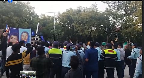 A video grab of the scuffle between security guards and the students.