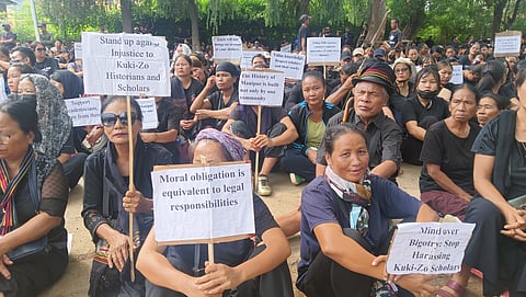People of the Kuki tribal community present in front of the commissionerate in Churachandpur.