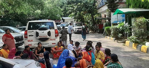 Union members and workers outside the police station