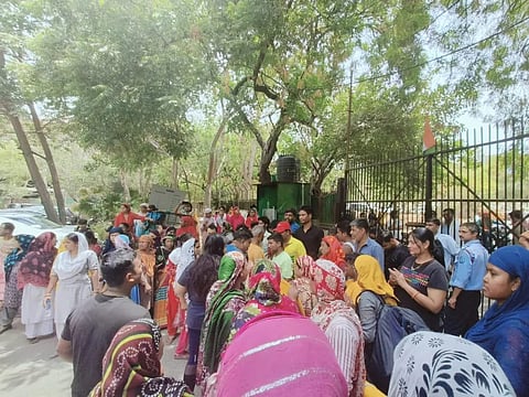 Workers mobilized outside the police station