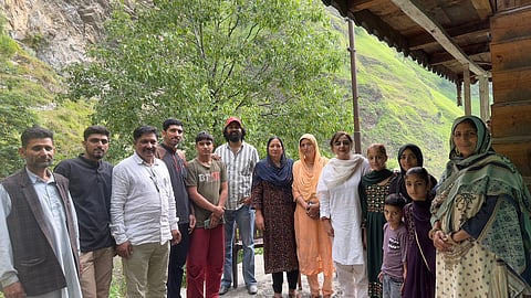 The villagers explain that when someone falls sick and needs to be rushed to the hospital, they have to carry them on a stretcher. Often, by the time they reach the road to find transport, the patient has already died.