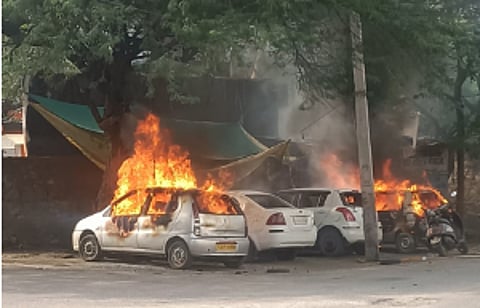 Vehicles parked in a garage were set on fire.
