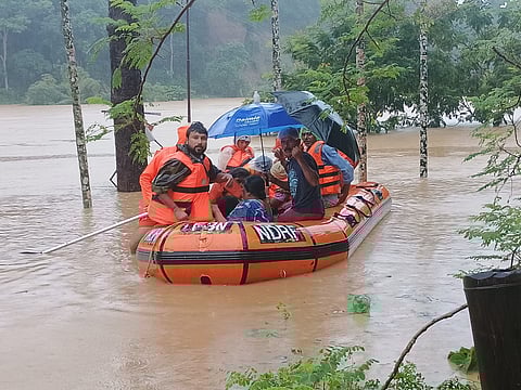 Rescue team assisting stranded people in Tripura.
