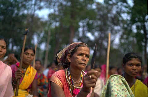 Adivasi women in Abujhmad forest showing their everyday tools at a protest site against illegal mining and “fake encounters” and arrests in the Central India’s Bastar region.