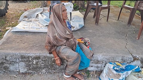 Shantibai sitting in the courtyard of her home.