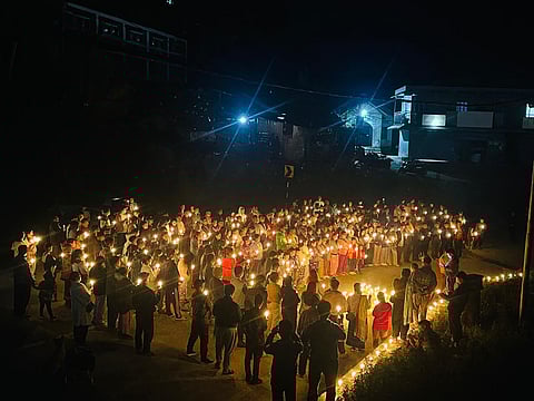 Meitei group held a candlelight march on Sunday condemning killing of six women & children.