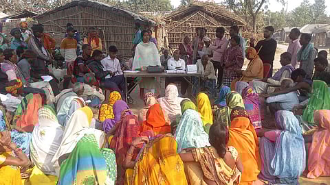 Seema Gautam raising awareness among villagers for the constitutional fight for land rights.