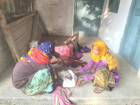 With no medical help in sight, the woman delivered her baby on the ground, surrounded only by her distraught family members.