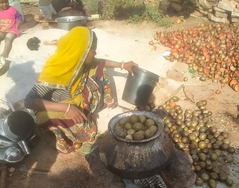 In Karahal, Sheopur - tribal family drying and processing fruits.
