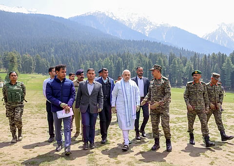 Union Home Minister Amit Shah visits the site of the Pahalgam terror attack and receives a detailed briefing about the incident from officers, in Anantnag, on April 23.