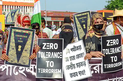 Members of a minority community take part in a protest against the Pahalgam attack, in Kolkata.