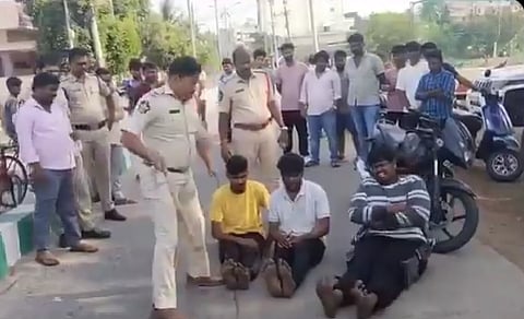 In the video, a cop could be seen hitting one of the men on his feet, while all three were made to sit with their legs straight.