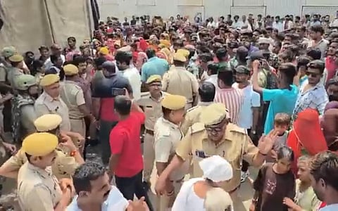 A large crowd of furious villagers descended on the Dabok Police Station, demanding the immediate arrest of the accused.