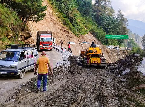 NHAI undertakes restoration work on the Kullu-Manali National Highway after a stretch was washed away due to flooding of the Beas River, near Cloth, on September 18.
