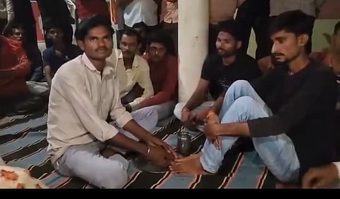 Viral videos show individuals with casteist mindsets compelling Purushottam to bow before the Shivling, wash Anuj's feet in a plate, and drink the water.