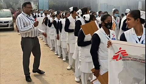 Dozens of students in white uniforms chanted the slogans together.