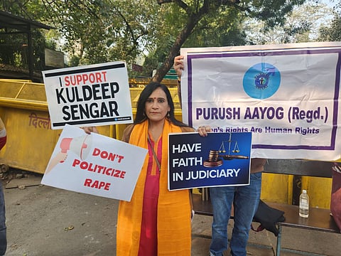 Barkha Trehan, president of the Purush Aayog (Men's Commission), at Jantar Mantar on Sunday carrying placards in support of Kuldeep Sengar.