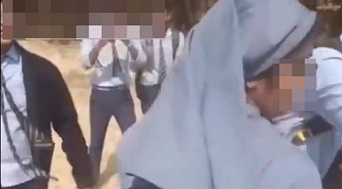 In the clip, a group of male students is seen harassing a Catholic nun by making sexually explicit remarks and references to adult film industry figures and platforms.