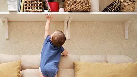 Baby trying to reach height