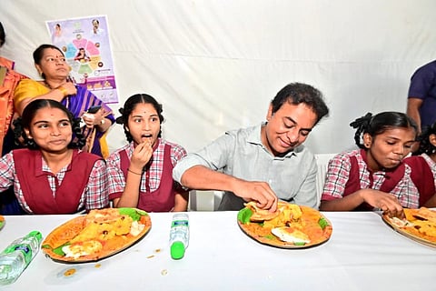 Telangana Municipal Administration and Urban Development minister KTR has breakfast with school students.