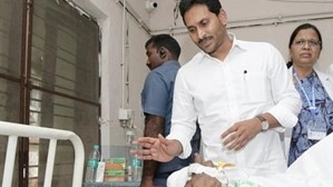 CM Jagan speaking to passenger being treated in hospital