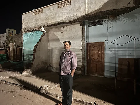 Nadeem Sheikh, standing in front of his demolished bakery, in Khargone, Madhya Pradesh